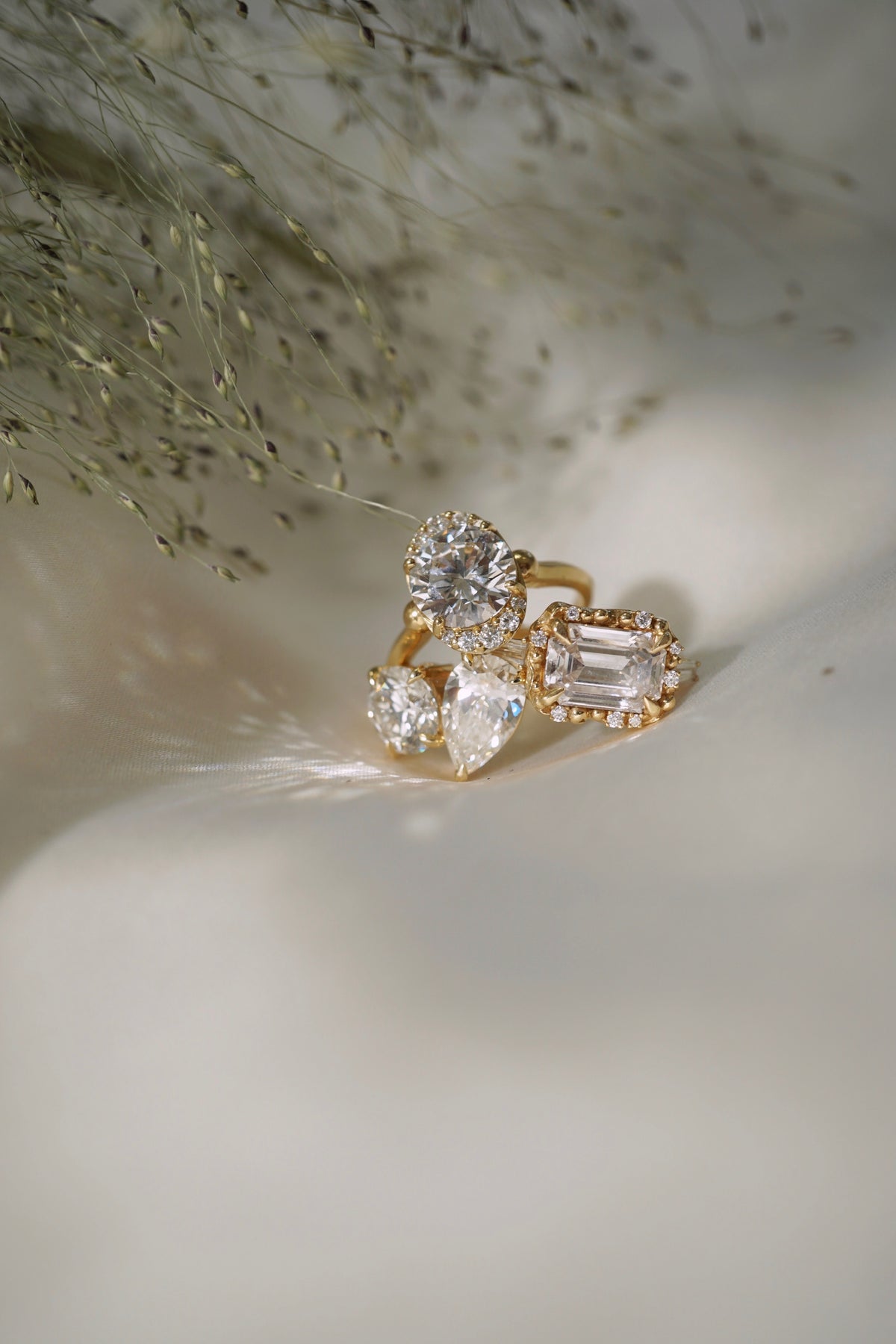 Diamond rings stacked on top of each other on a white background.