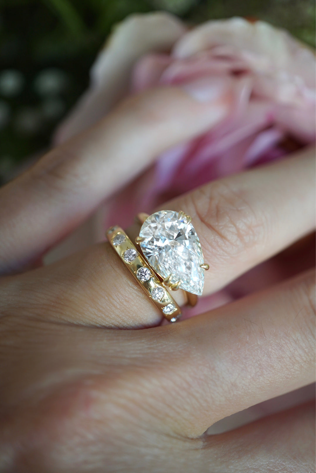 A close shot of a hand modeling a ring from the BaYou bridal collection.